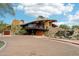 Community clubhouse with a stone facade and a waterfall feature at 27016 N 14Th Ln, Phoenix, AZ 85085