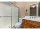 Bathroom with shower, toilet, and wood vanity at 13232 W Los Bancos Dr, Sun City West, AZ 85375