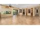 Spacious living room with tile floors, high ceilings, and access to the backyard at 13232 W Los Bancos Dr, Sun City West, AZ 85375
