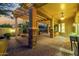 Covered patio with fire pit, pergola, and seating area at 13232 W Los Bancos Dr, Sun City West, AZ 85375
