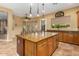 Modern kitchen featuring granite countertops and large island at 13232 W Los Bancos Dr, Sun City West, AZ 85375
