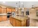 Updated kitchen with granite island and ample cabinet space at 13232 W Los Bancos Dr, Sun City West, AZ 85375