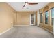 Bright bedroom featuring large windows and ceiling fan at 13232 W Los Bancos Dr, Sun City West, AZ 85375