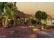 Landscaped yard with a walkway leading to a two-story home at 13232 W Los Bancos Dr, Sun City West, AZ 85375
