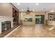 Living area with fireplace, built-ins and sliding glass doors at 13232 W Los Bancos Dr, Sun City West, AZ 85375