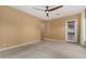 Spacious bedroom with carpeted floor and ceiling fan at 13232 W Los Bancos Dr, Sun City West, AZ 85375