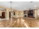 Bright living room featuring a fireplace and large windows at 13232 W Los Bancos Dr, Sun City West, AZ 85375