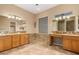 Elegant bathroom with granite countertops and double sinks at 13232 W Los Bancos Dr, Sun City West, AZ 85375