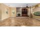 Living room featuring a built-in entertainment center and fireplace at 13232 W Los Bancos Dr, Sun City West, AZ 85375