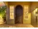 Elegant front door with an ornate iron security screen at 13232 W Los Bancos Dr, Sun City West, AZ 85375