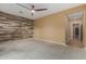 Bedroom with wood-look wall and carpet at 13232 W Los Bancos Dr, Sun City West, AZ 85375