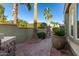 Landscaped side yard with stone pathway and planter at 13232 W Los Bancos Dr, Sun City West, AZ 85375