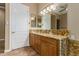 Well-appointed bathroom with granite countertop and double sinks at 13232 W Los Bancos Dr, Sun City West, AZ 85375