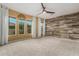 Bedroom with large windows and wood-like wall at 13232 W Los Bancos Dr, Sun City West, AZ 85375