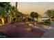 Landscaped yard with a walkway leading to a two-story home at 13232 W Los Bancos Dr, Sun City West, AZ 85375