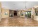 Spacious living room with fireplace and tile floors at 13232 W Los Bancos Dr, Sun City West, AZ 85375
