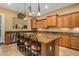 Gourmet kitchen with granite island and stainless steel appliances at 13232 W Los Bancos Dr, Sun City West, AZ 85375