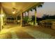 Covered patio with brick pavers, ceiling fan, and seating area at 13232 W Los Bancos Dr, Sun City West, AZ 85375