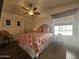 Cozy bedroom with hardwood floors and stylish bedding at 8700 E University Dr # 2020, Mesa, AZ 85207