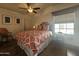 Bright bedroom with hardwood floors and ceiling fan at 8700 E University Dr # 2020, Mesa, AZ 85207