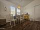 Charming dining area with a rustic table and chairs at 8700 E University Dr # 2020, Mesa, AZ 85207