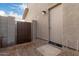 Landscaped backyard with gravel, a gate, and a block wall at 31751 N Velvet Rush Rd, San Tan Valley, AZ 85143