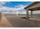 Backyard with gravel, a covered patio, and a small patch of grass at 31751 N Velvet Rush Rd, San Tan Valley, AZ 85143