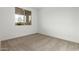 Bright bedroom with carpet flooring and a window offering natural light at 31751 N Velvet Rush Rd, San Tan Valley, AZ 85143