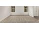 Bright bedroom with neutral carpeting and large windows at 31751 N Velvet Rush Rd, San Tan Valley, AZ 85143