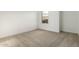Well lit bedroom featuring neutral wall and carpet at 31751 N Velvet Rush Rd, San Tan Valley, AZ 85143