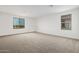 Spacious bedroom with plush carpeting and large windows at 31751 N Velvet Rush Rd, San Tan Valley, AZ 85143