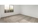 Bright bedroom with neutral carpeting and window at 31751 N Velvet Rush Rd, San Tan Valley, AZ 85143