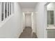 Bright entryway with tile flooring, staircase, and half bathroom at 31751 N Velvet Rush Rd, San Tan Valley, AZ 85143