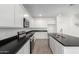 Modern kitchen with stainless steel appliances and dark countertops at 31751 N Velvet Rush Rd, San Tan Valley, AZ 85143