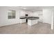 Modern kitchen with island, stainless steel appliances, and white cabinetry at 31751 N Velvet Rush Rd, San Tan Valley, AZ 85143