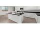 Modern kitchen with large island and dark countertops at 31751 N Velvet Rush Rd, San Tan Valley, AZ 85143