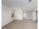 Open loft area with carpet, a window, and access to upper floor at 31751 N Velvet Rush Rd, San Tan Valley, AZ 85143