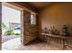 Inviting entryway with stone pillars and a rustic console table at 28694 N 127Th Ln, Peoria, AZ 85383