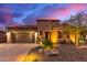 Single-story home with stone accents and desert landscaping at 28694 N 127Th Ln, Peoria, AZ 85383