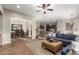 Open concept living area with a view of the dining room and kitchen at 28694 N 127Th Ln, Peoria, AZ 85383