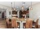 Gourmet kitchen boasts granite countertops, modern cabinetry, and a large island with seating at 28694 N 127Th Ln, Peoria, AZ 85383