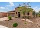 One-story home with stone accents and desert landscaping at 28694 N 127Th Ln, Peoria, AZ 85383