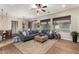 Open living room with hardwood floors and a sectional sofa at 28694 N 127Th Ln, Peoria, AZ 85383