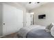 Bright bedroom with double doors and built-in closet at 28694 N 127Th Ln, Peoria, AZ 85383