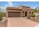 Charming house with stone accents and a 2-car garage at 28694 N 127Th Ln, Peoria, AZ 85383