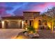 Single-story home with stone accents and desert landscaping at 28694 N 127Th Ln, Peoria, AZ 85383