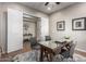 Home office with glass-top desk and two comfortable chairs at 28694 N 127Th Ln, Peoria, AZ 85383