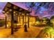 Relaxing patio with pergola, fire pit, and comfortable seating at 28694 N 127Th Ln, Peoria, AZ 85383