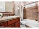 Bathroom with tiled shower/tub combo and updated vanity at 28694 N 127Th Ln, Peoria, AZ 85383