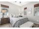 Comfortable bedroom with plush bedding and window seating at 28694 N 127Th Ln, Peoria, AZ 85383